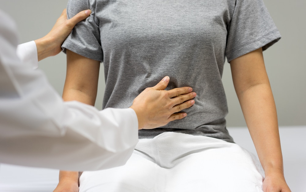 A woman is undergoing a fertility examination with a doctor.