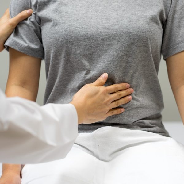 A woman is undergoing a fertility examination with a doctor.