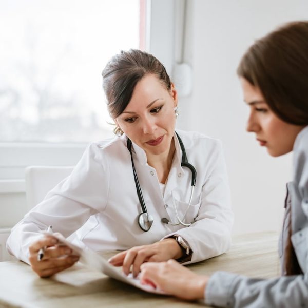 A female doctor is discussing family planning with a female patient.